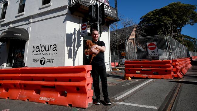 Businesses along the light rail construction corridor such as Richard Campbell’s Eloura hair salon are feeling the effects of project delays. Picture: Toby Zerna