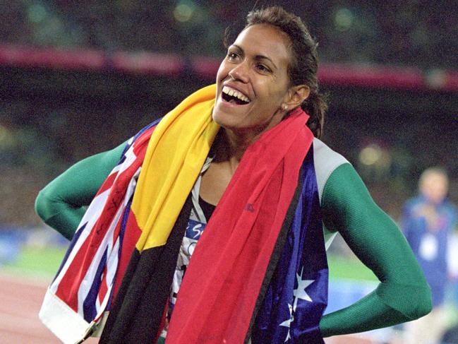 25 Sep 2000:  Cathy Freeman of Australia is elated after winning Gold in the 400m Final during the 2000 Sydney Olympic Games at Stadium Australia in Sydney, Australia. Mandatory Credit: Nick Wilson/ALLSPORT