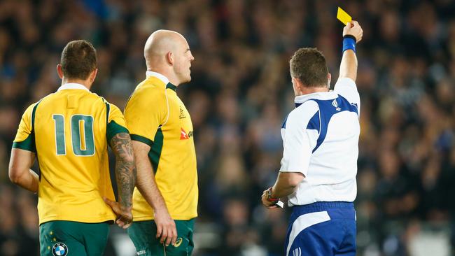 AUCKLAND, NEW ZEALAND - AUGUST 15: Referee Nigel Owens shows Quade Cooper of the Wallabies a yellow card as Stephen Moore looks on during The Rugby Championship, Bledisloe Cup match between the New Zealand All Blacks and the Australian Wallabies at Eden Park on August 15, 2015 in Auckland, New Zealand. (Photo by Phil Walter/Getty Images)