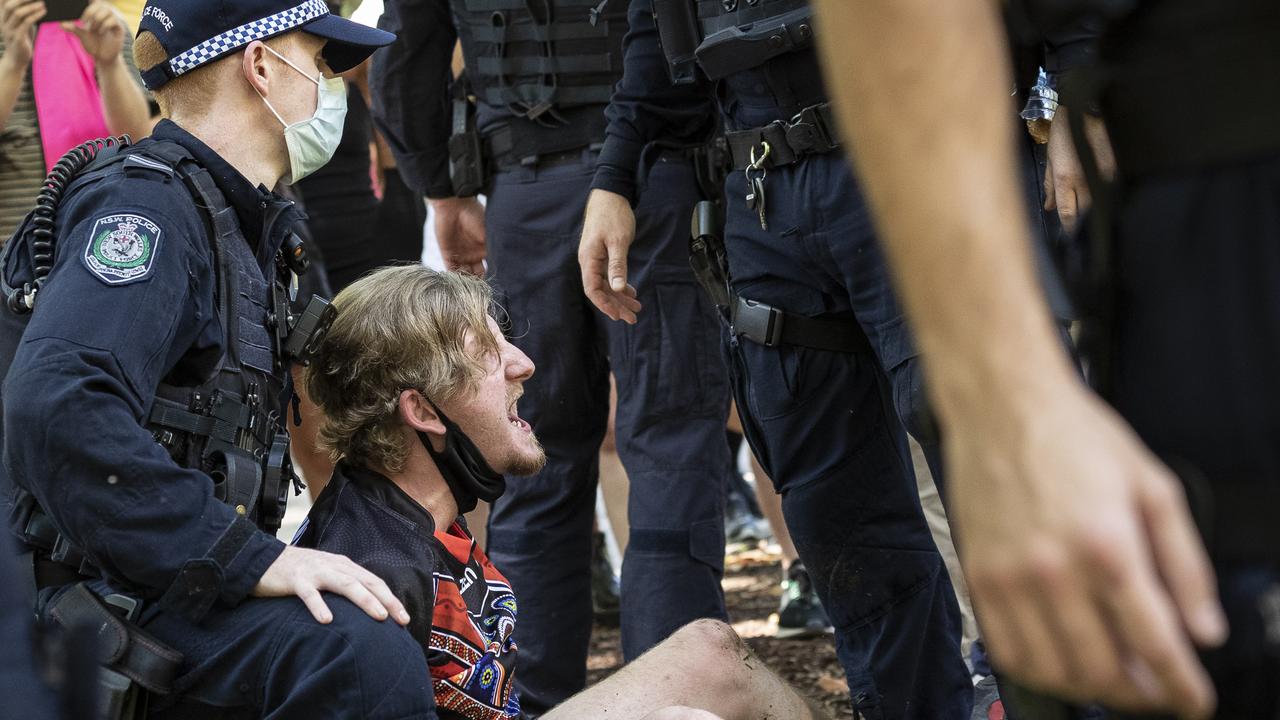 A man is arrested in Hyde Park for marching after the official Invasion Day rally. Picture: Brook Mitchell/Getty Images.