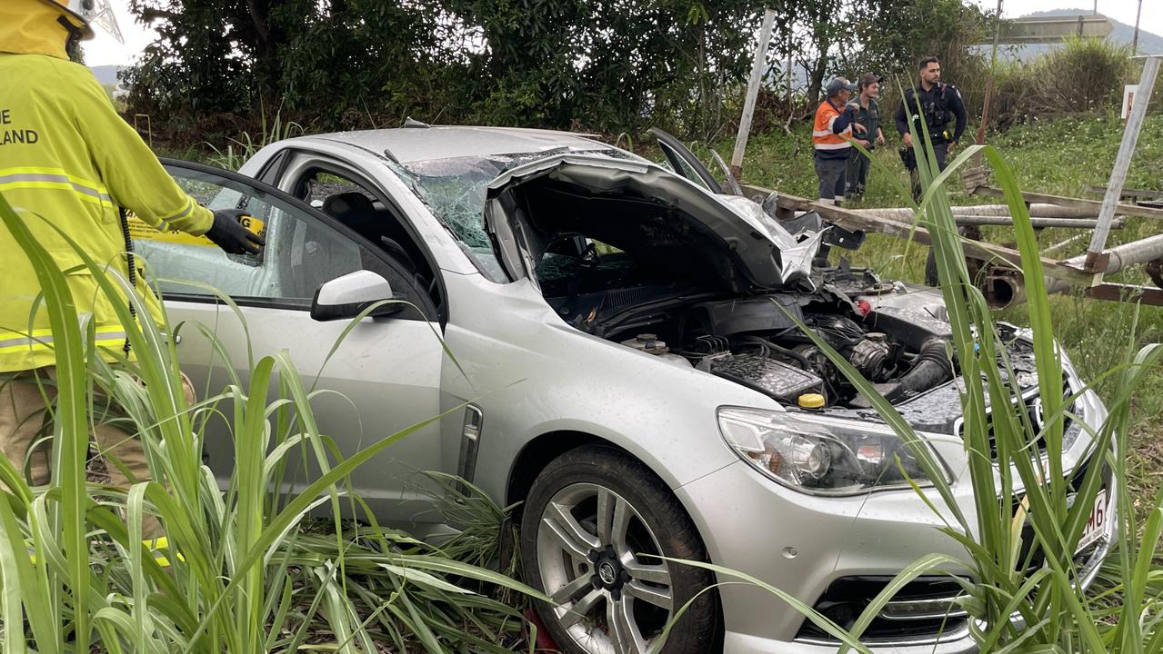 Car crash in Farleigh, Mackay: Driver trapped after poles smash through ...