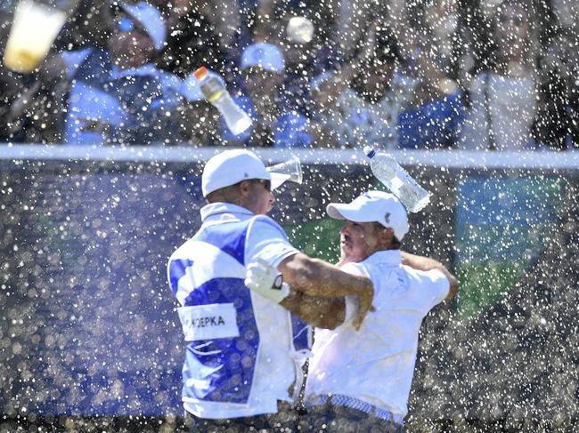 ADELAIDE, AUSTRALIA - APRIL 23: Chase Koepka of the Smash celebrates a hole in one with his caddie on the 12th showered in beer from the crowd during day three of Liv Golf Adelaide at The Grange Golf Course on April 23, 2023 in Adelaide, Australia. (Photo by Mark Brake/Getty Images)