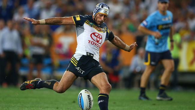 Johnathan Thurston kicks a field goal to win the 2015 NRL grand final for the Cowboys. There are plans for a statue of Thurston outside the new Townsville stadium but Newcastle fans want to get in first with a statue of Andrew Johns. Picture: Getty Images