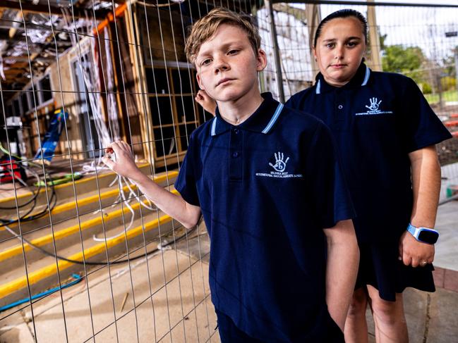 Lucas Whitelegg and Zara Frazzica in front of ongoing school refurbishment work at Mildura West Primary School Picture: Brandan McGlynn