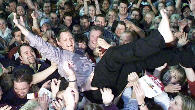 Kevin Walters crowd surfs at the Broncos Leagues Club after the 2000 grand final.