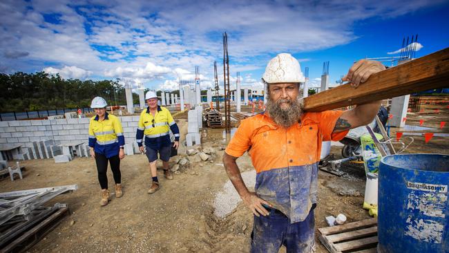 Labourer Kurt McLean doing the heavy lifting at a Queensland construction site. Picture: Nigel Hallett