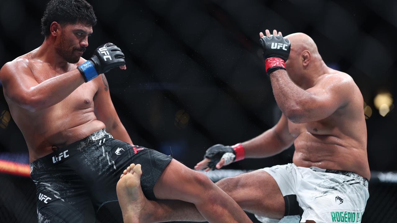 Marcos Rogerio de Lima (right) kicks Junior Tafa’s leg. (Photo by Sean M. Haffey/Getty Images)