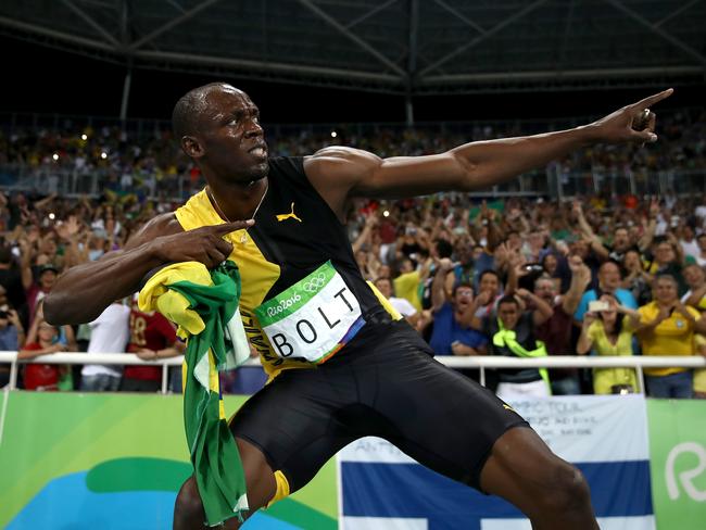 Usain Bolt of Jamaica celebrates after winning the Men's 4x100m Relay.
