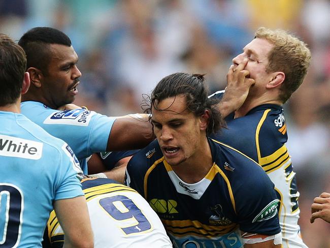 Waratahs star Kurtley Beale (left) has a physical disagreement with Brumbies star David Pocock.