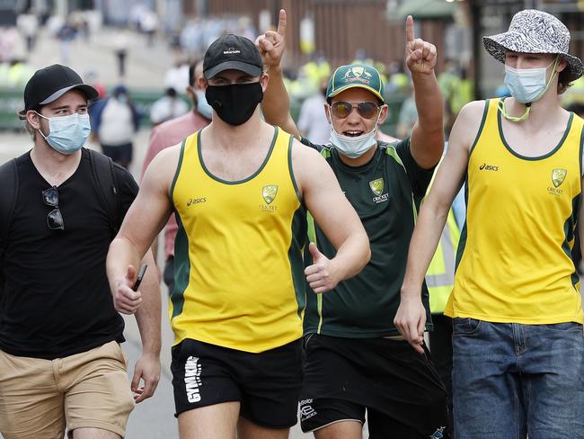 Masked Aussie fans arrive for the first day. Picture: Nikki Short