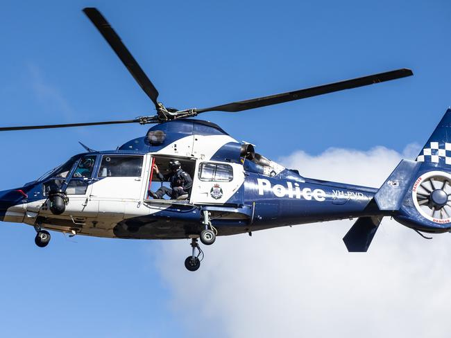 Police and SES crews scour rugged terrain in Mount Buffalo as they search for missing Melbourne couple,Trevor Salvado and Jacinta Bohan. Police air wing head up to search for the missing couple. Picture: Sarah Matray