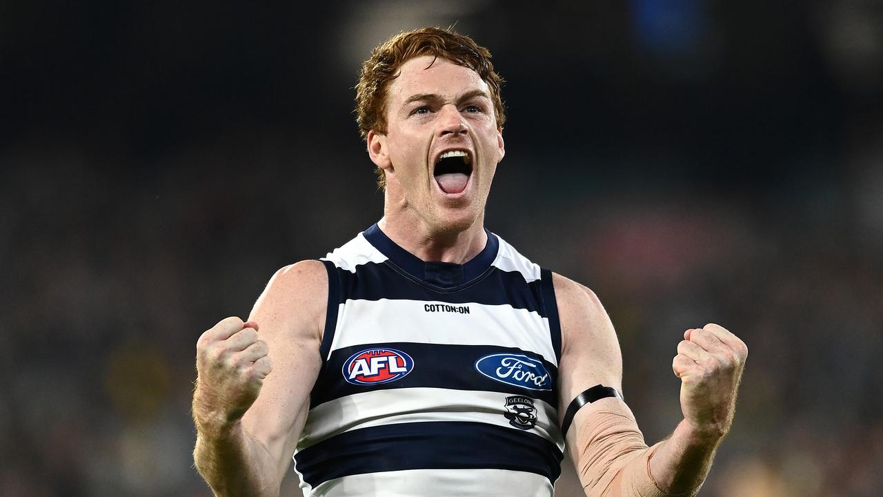 Gary Rohan of the Cats celebrates kicking a goal against Richmond.