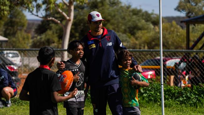 Melbourne Demons players Shane McAdam and Andy Moniz-Wakefield went to Santa Teresa ahead of the 2025 AFL game in Alice Springs. Picture: Melbourne Demons