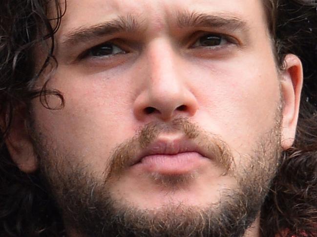 British actor Kit Harington sits in the Royal Box on Centre Court to watch US player Christina McHale play against Germany's Sabine Lisicki during their women's singles second round match on day four of the 2015 Wimbledon Championships at The All England Tennis Club in Wimbledon, southwest London, on July 2, 2015. RESTRICTED TO EDITORIAL USE -- AFP PHOTO / GLYN KIRK