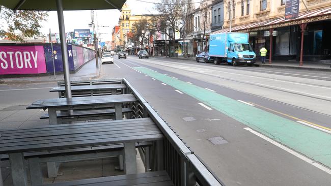 Chapel Street has remained deserted since this photo taken on the first day of Melbourne’s second lockdown, then announced as six weeks, on July 3. Picture: David Crosling