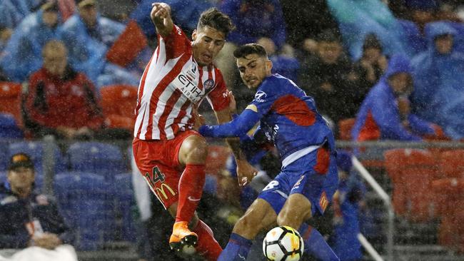 John Koutroumbis of the Jets (right) competes for possession with Daniel Arzani of City during the A-League semi final.