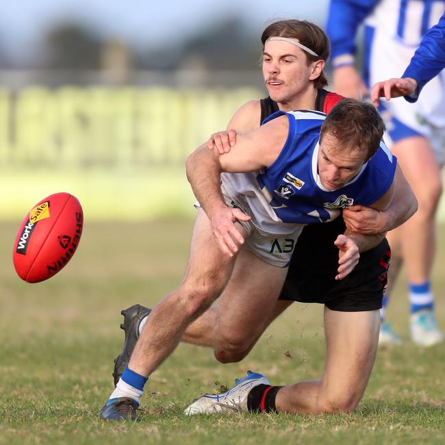 Irrewarra-Beac’s Toby Monaco tackles South Colac’s Brendan Monaghan.