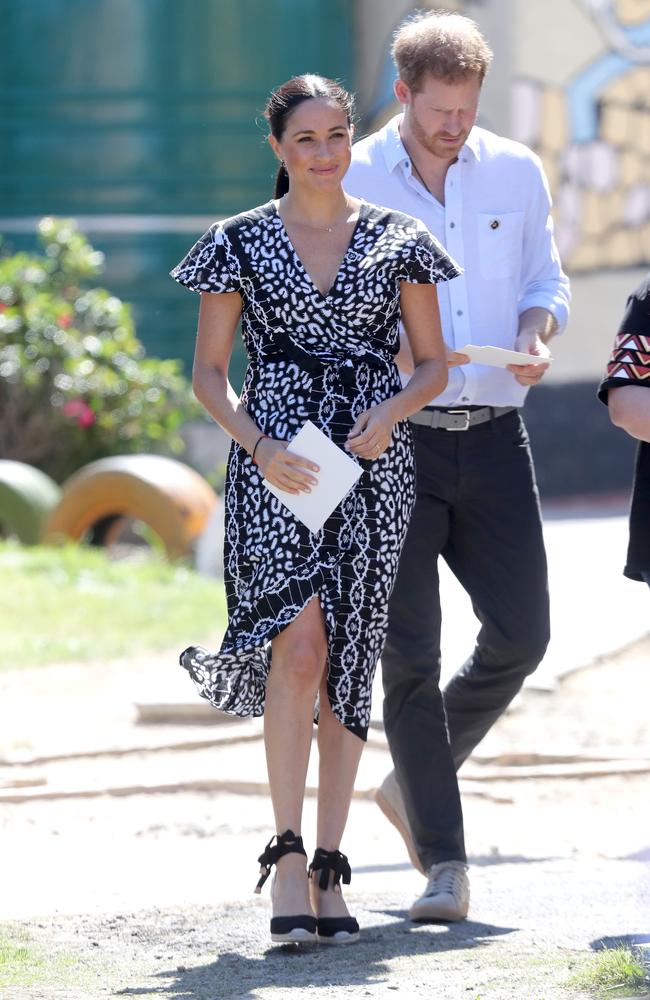 The Duke and Duchess of Sussex smile as they visit a Justice Desk initiative in Nyanga township. Picture: Chris Jackson/Getty Images