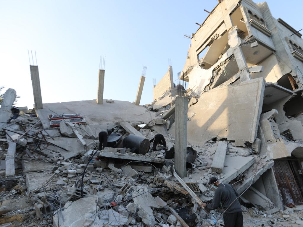 People inspect damage and recover items from their homes following Israeli air strikes on April 02, 2024 in Rafah, Gaza. Picture: Ahmad Hasaballah/Getty Images