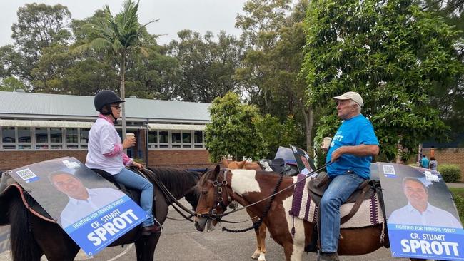 Liberal councillor Stuart Sprott, who is running for re-election in the Frenchs Forest Ward on Northern Beaches Council, had some equine support from horse owners at Wakehurst Public School. Picture: Stuart Sprott