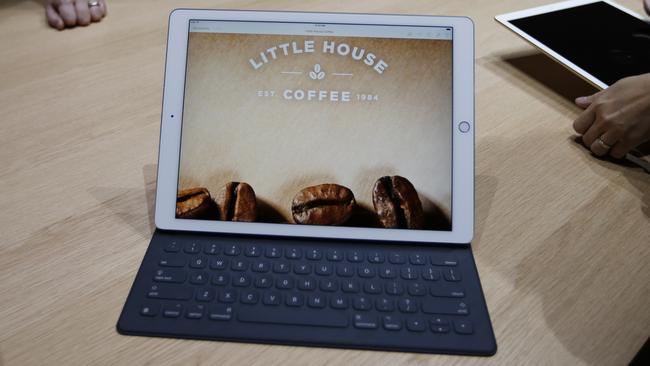 An Apple iPad Pro with a Smart Keyboard attached. It’s bigger than an entry level MacBook Air.