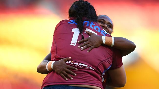 Liz Patu of the Reds celebrates with teammates after scoring a try. (Photo by Albert Perez/Getty Images)