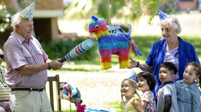 Bevan, 94, has a turn at the pinata in a scene from the TV series Old People's Home for 4 Year Olds. . Picture: Nigel Wright