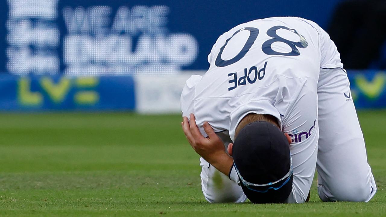 England's Ollie Pope reacts after again injuring his shoulder while fielding. Picture: AFP