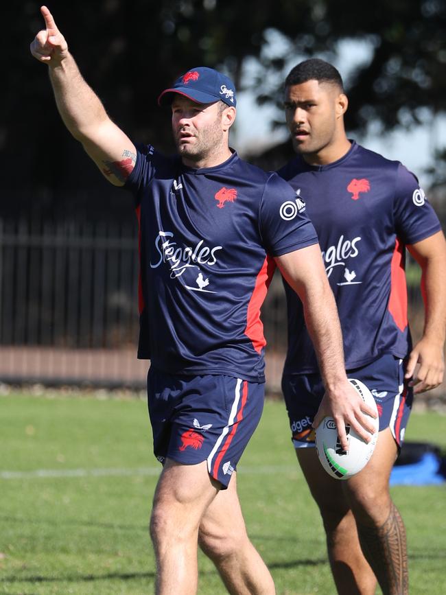 Roosters football players exercise on Kippax Lake at Moore Park. Blue cap is Boyd Cordner . .picture John Grainger