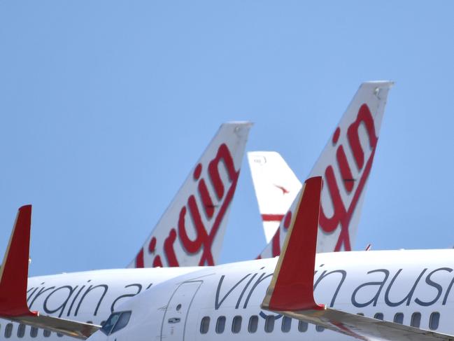 Virgin Australia planes parked on the tarmac at Adelaide Airport. Picture: AAP.