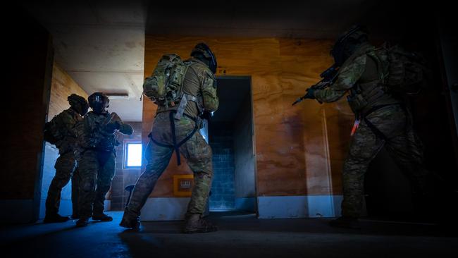 Australian army soldiers from the 3rd Battalion, Royal Australian Regiment, conduct a room clearance during an urban assault serial utilising the Blue Bolt non-lethal training ammunition, as part of the 2022 Duke of Gloucester Cup in Singleton. *** Local Caption *** Australian Army infantry soldiers from across Australia tested their core skills for the prestigious Duke of Gloucester Cup at the School of Infantry, near Singleton in NSW, July 31 - August 5 2022. The Duke of Gloucester Cup is the Armyâ€™s premier military skills competition, pitting the best Royal Australian Corps of Infantry rifle sections from each unit against one another through a series of challenging activities that test their core infantry skills, including marksmanship, tactics, teamwork and fitness. Along with the Duke of Gloucester Cup, five other trophies are awarded: Sir Arthur MacDonald Trophy for best foundation war-fighting skills; Gurkha Trophy for best live-fire shooting; Royal Ulster Rifles Trophy for best falling plate shooting; OSCMAR Trophy for best battle endurance; and the DSM Roche CSC Memorial Cup for best individual soldier. The Duke of Gloucester Cup was created by Prince Henry, Duke of Gloucester, in 1946, while serving as the Governor-General of Australia.