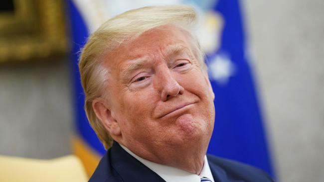 US President Donald Trump smiles as he meets with Florida Governor Ron DeSantis in the Oval Office of the White House in 2020.