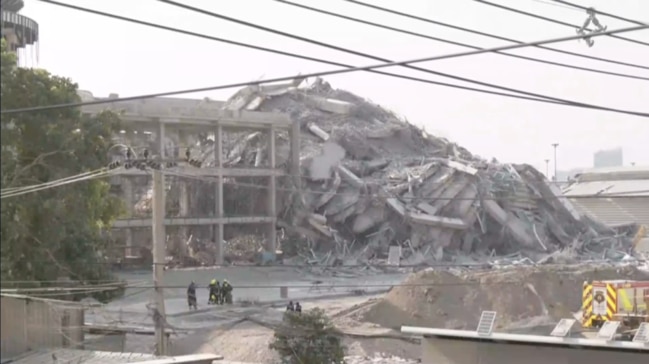 At least 80 people are believed to be trapped in the rubble of the collapsed building. Picture: Reuters