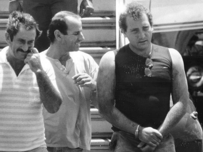 Senior Constable's Les Chapman and Matt Sidoli escort Jonathon Bakewell from a plane at the Darwin Airport after he was caught by police in Alice Springs and arrested over the murder of Anne-Marie Culleton. Published: 28/2/1988. Page 1.