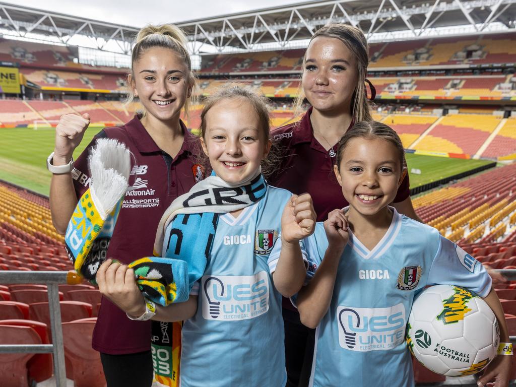 Brisbane Roar’s Hollie Palmer and Football Queensland academy player Amali Kinsella with Brisbane City FC juniors Ines Lockwood, 7 and Isla Smith, 8, who are pumped for the Women’s World Cup next year. Picture: Matthew Poon