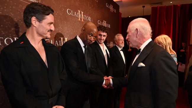 The King appeared to initiate a handshake with Denzel Washington much to his relief. Picture: AFP