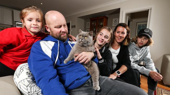 Silvie the British shorthair is reunited with Quinn, 6, Steve, Silvie, Eve, 12, Felicity and Will Crossland, 14, after going missing for eight years. Picture: Tim Carrafa