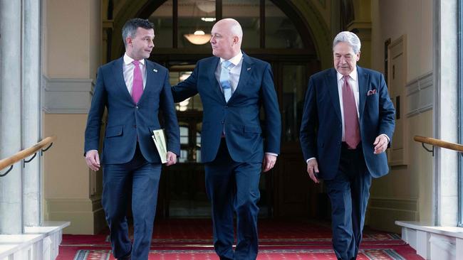 (L-R) David Seymour, leader of the ACT New Zealand party, New Zealand's incoming Prime Minister Christopher Luxon, and Winston Peters, leader of New Zealand First party. Picture: AFP.