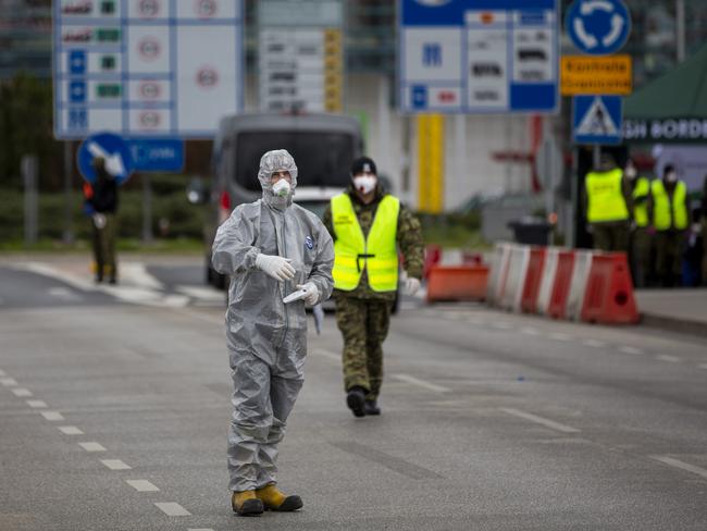 Border control guards and medical workers measure temperatures of those crossing the German-Polish border at Slubice and Frankfurt. Picture: Maja Hitij/Getty