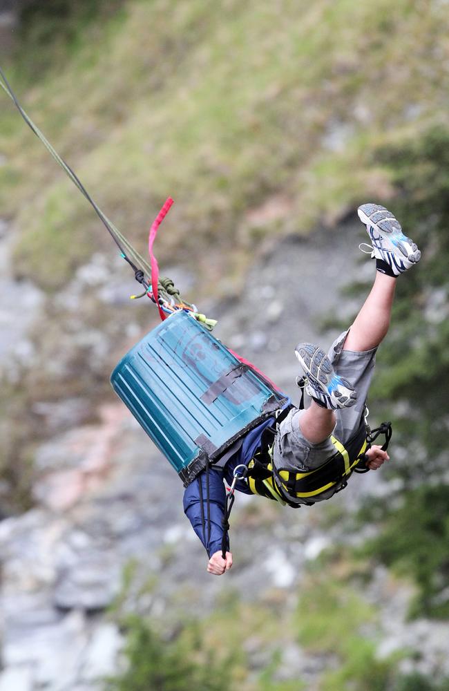 Bulldogs forward Andrew Hooper had to do the canyon swing with a rubbish bin on his head.