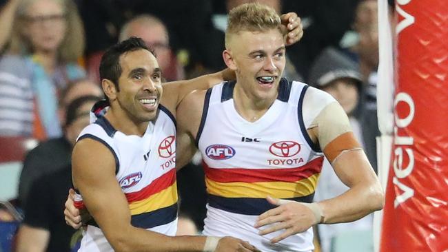 Hugh Greenwood and Eddie Betts celebrate a goal. (Photo by Scott Barbour/Getty Images)