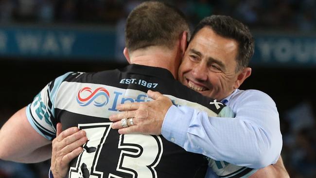 Paul Gallen and Shane Flanagan (R) celebrate grand final victory.