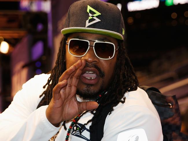PHOENIX, AZ - JANUARY 27: Marshawn Lynch #24 of the Seattle Seahawks addresses the media at Super Bowl XLIX Media Day Fueled by Gatorade inside U.S. Airways Center on January 27, 2015 in Phoenix, Arizona. Christian Petersen/Getty Images/AFP == FOR NEWSPAPERS, INTERNET, TELCOS & TELEVISION USE ONLY ==