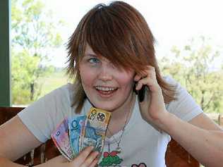 Lauren Yuile, 15 years, is the youngest member of the family with a mobile phone which she thinks saves money.