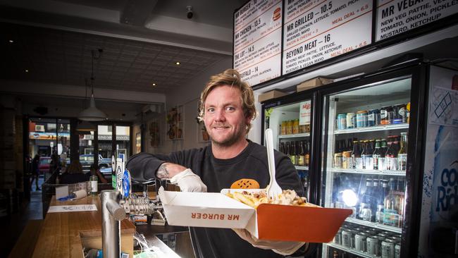 Alexander Haros, owner of Mr Burger in Liverpool Street is pleased Myer is opening back up tomorrow. Picture: LUKE BOWDEN