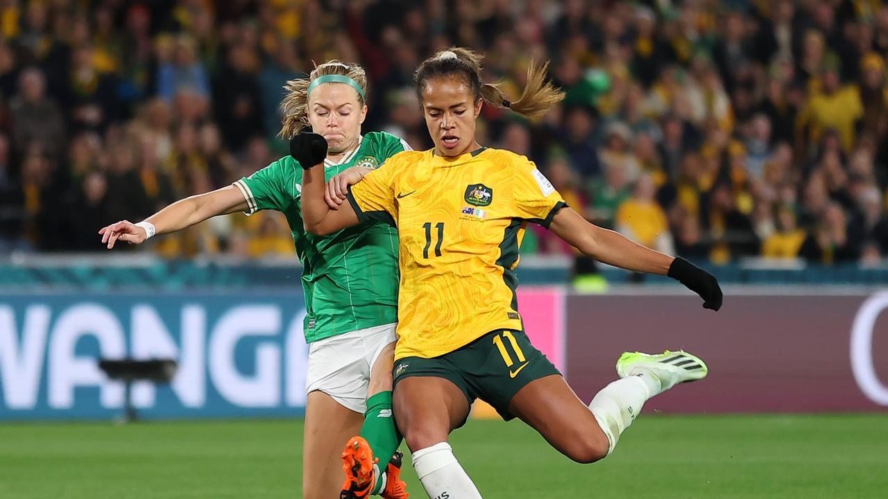 SYDNEY, AUSTRALIA - JULY 20: Mary Fowler of Australia shoots at goal while Ruesha Littlejohn of Republic of Ireland attempts to block during the FIFA Women's World Cup Australia &amp; New Zealand 2023 Group B match between Australia and Ireland at Stadium Australia on July 20, 2023 in Sydney, Australia. (Photo by Cameron Spencer/Getty Images)