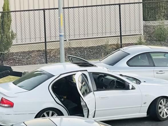 A police robot examines the car in which Clent Wilson was found.