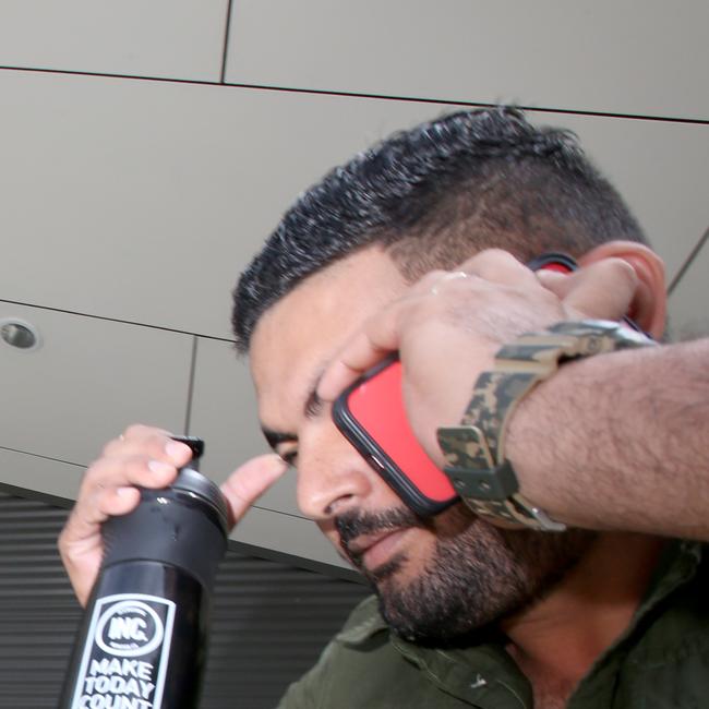 Manpreet Singh Brar went to great lengths to hide his face at the Pine Rivers Magistrates Court on Wednesday. Photo: Steve Pohlner.