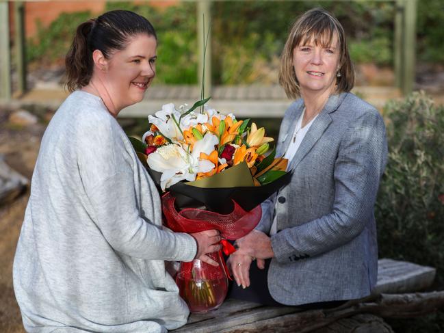 Sienna’s teacher Nicole Perry with principal Liz Keogh at the frog pond at All Saints Catholic Primary School, Seaford. Picture: Russell Millard.