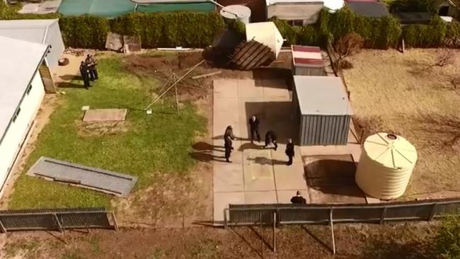 Geoffrey Adams showing police where his wife’s body is believed to be buried at his former Maitland home.